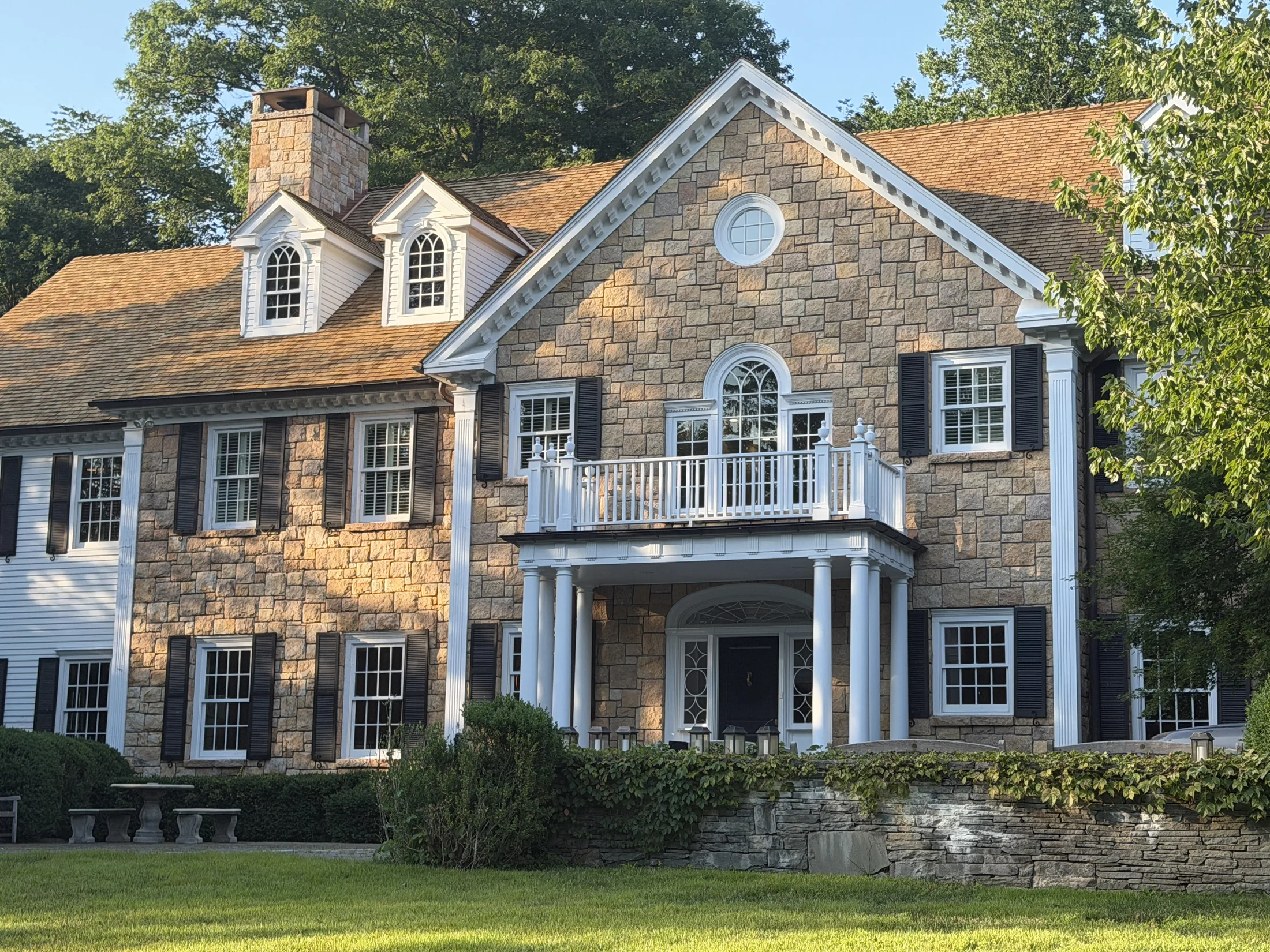 Cedar shake roof installed by Castle Home Restorations on a stone colonial home in Connecticut